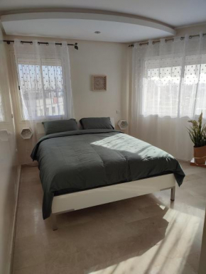 Chaleureux Appartement à 1 min à pied de la Mosquée Hassan II